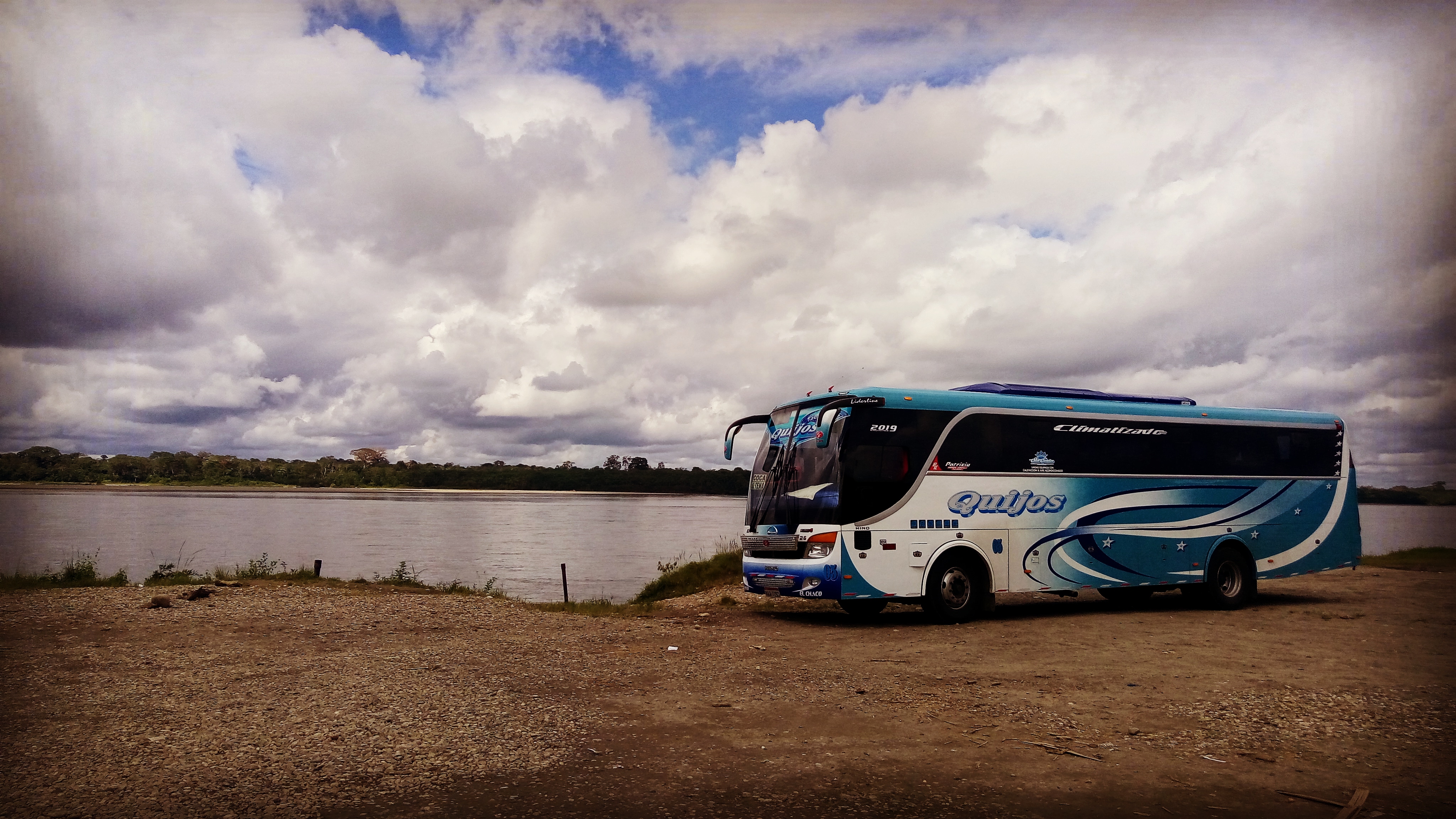 a bus by a river
